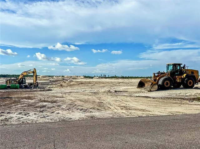 a view of a street with a building in the background