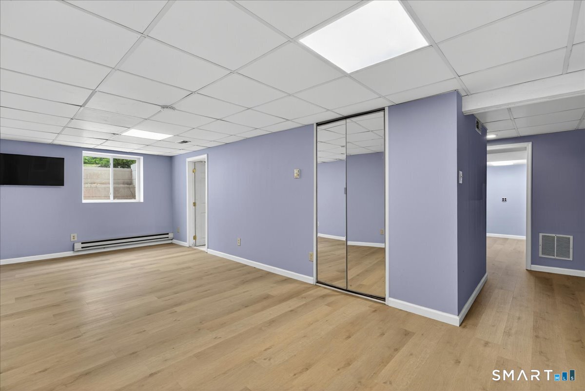 1006 King Road Cheshire, CT 06410 - Photo 24 of 40 The lower level is finished and heated, has natural light and offers great additional space to enjoy!