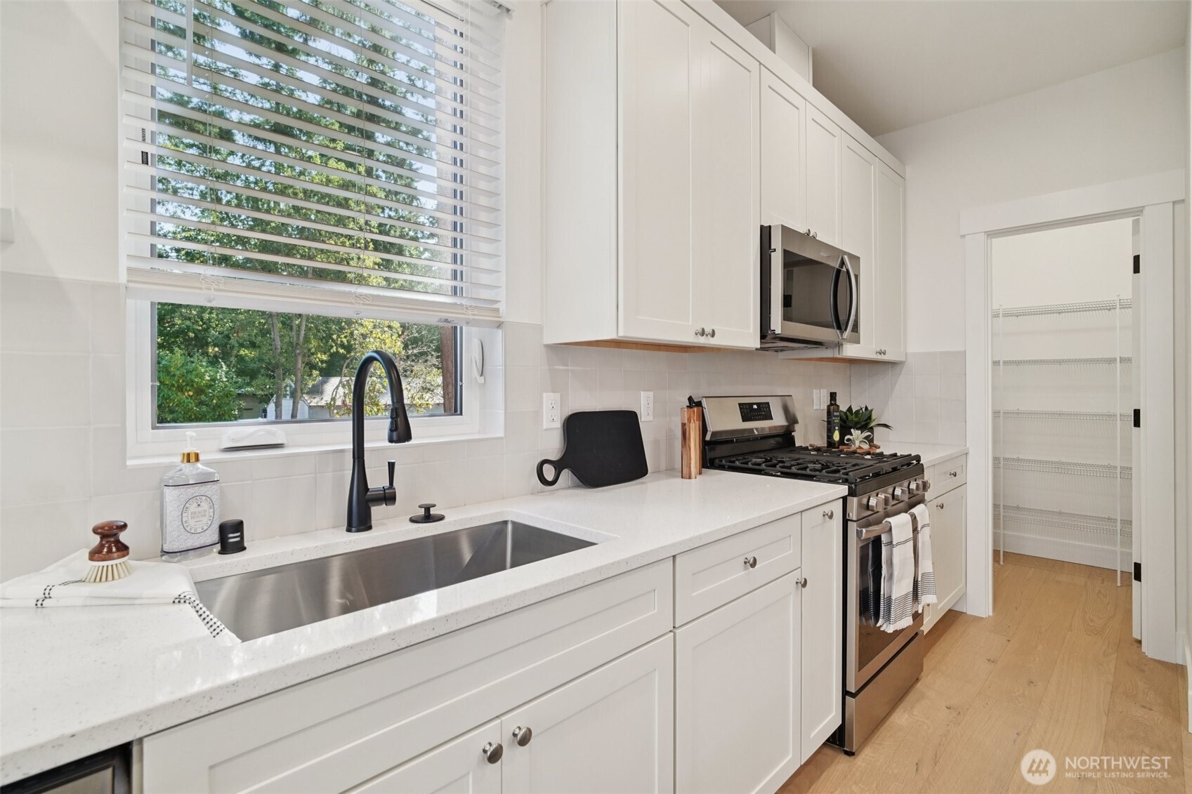 8014 222nd Street Southwest Edmonds, WA 98026 - Photo 3 of 29 a view of a kitchen with a sink and cabinets