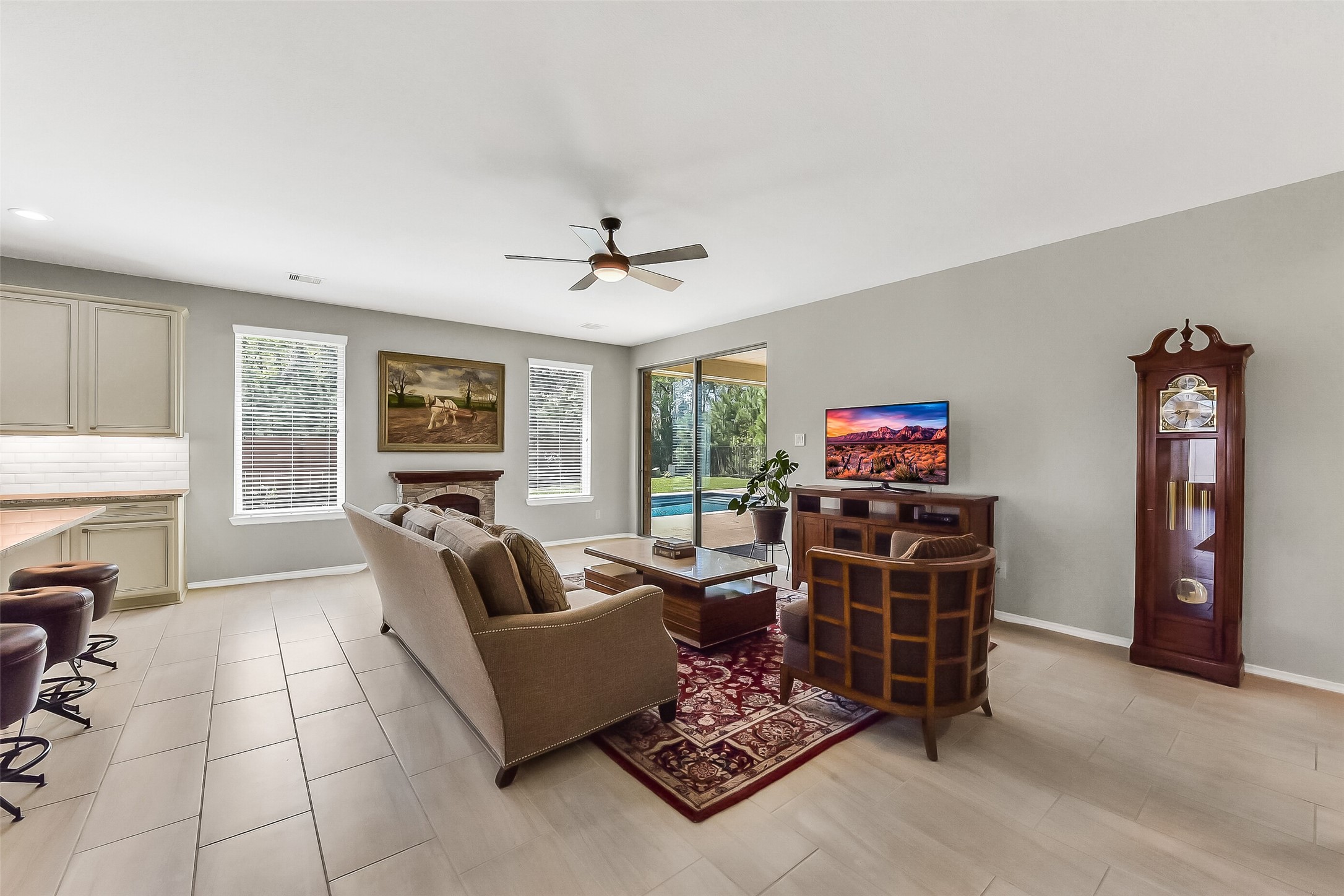 24407 Hollow Gate Meadow Court Spring, TX 77389 - Photo 13 of 39 a living room with furniture a flat screen tv and a window