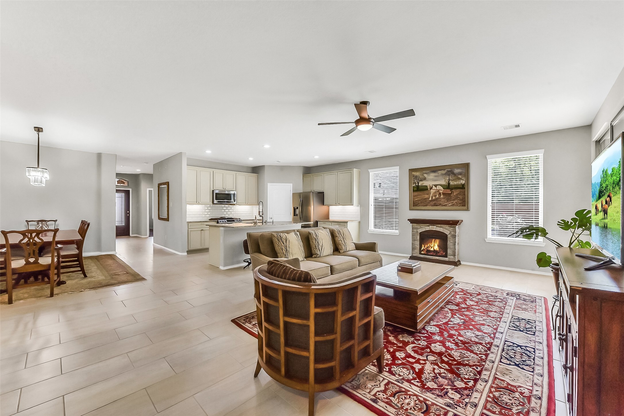 24407 Hollow Gate Meadow Court Spring, TX 77389 - Photo 14 of 39 a living room with furniture and a fireplace