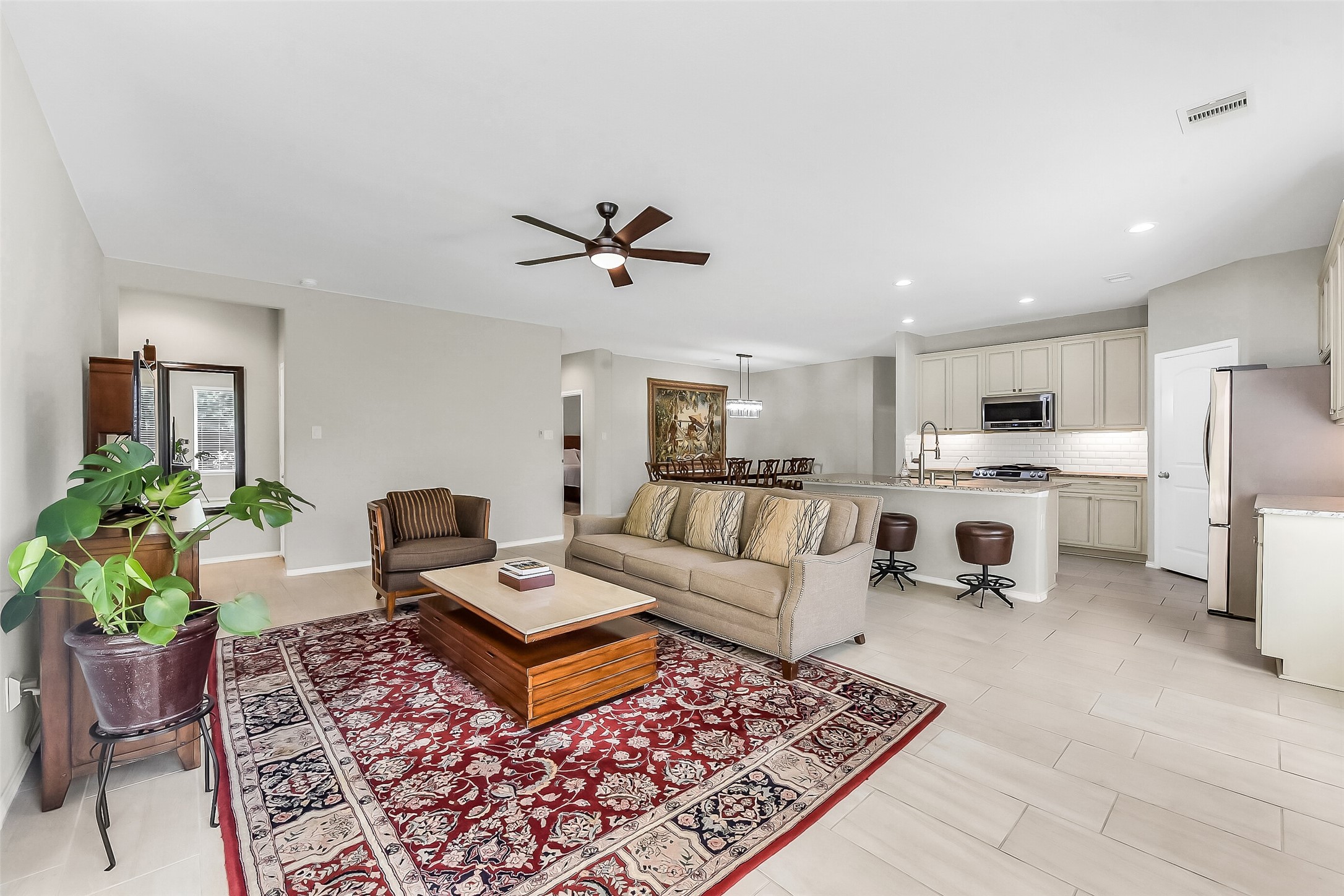 24407 Hollow Gate Meadow Court Spring, TX 77389 - Photo 15 of 39 a living room with furniture and kitchen view