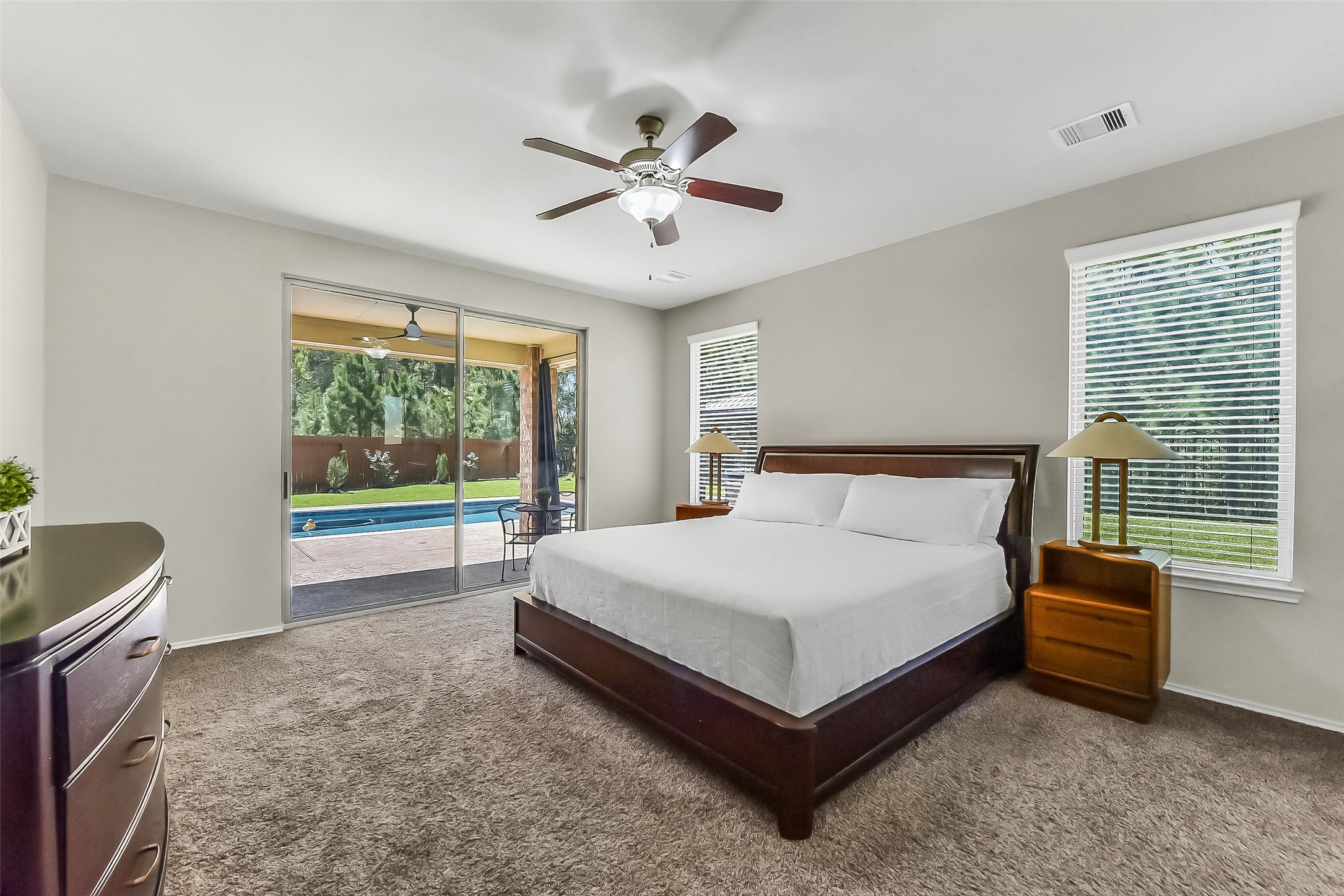 24407 Hollow Gate Meadow Court Spring, TX 77389 - Photo 18 of 39 a spacious bedroom with a bed and window