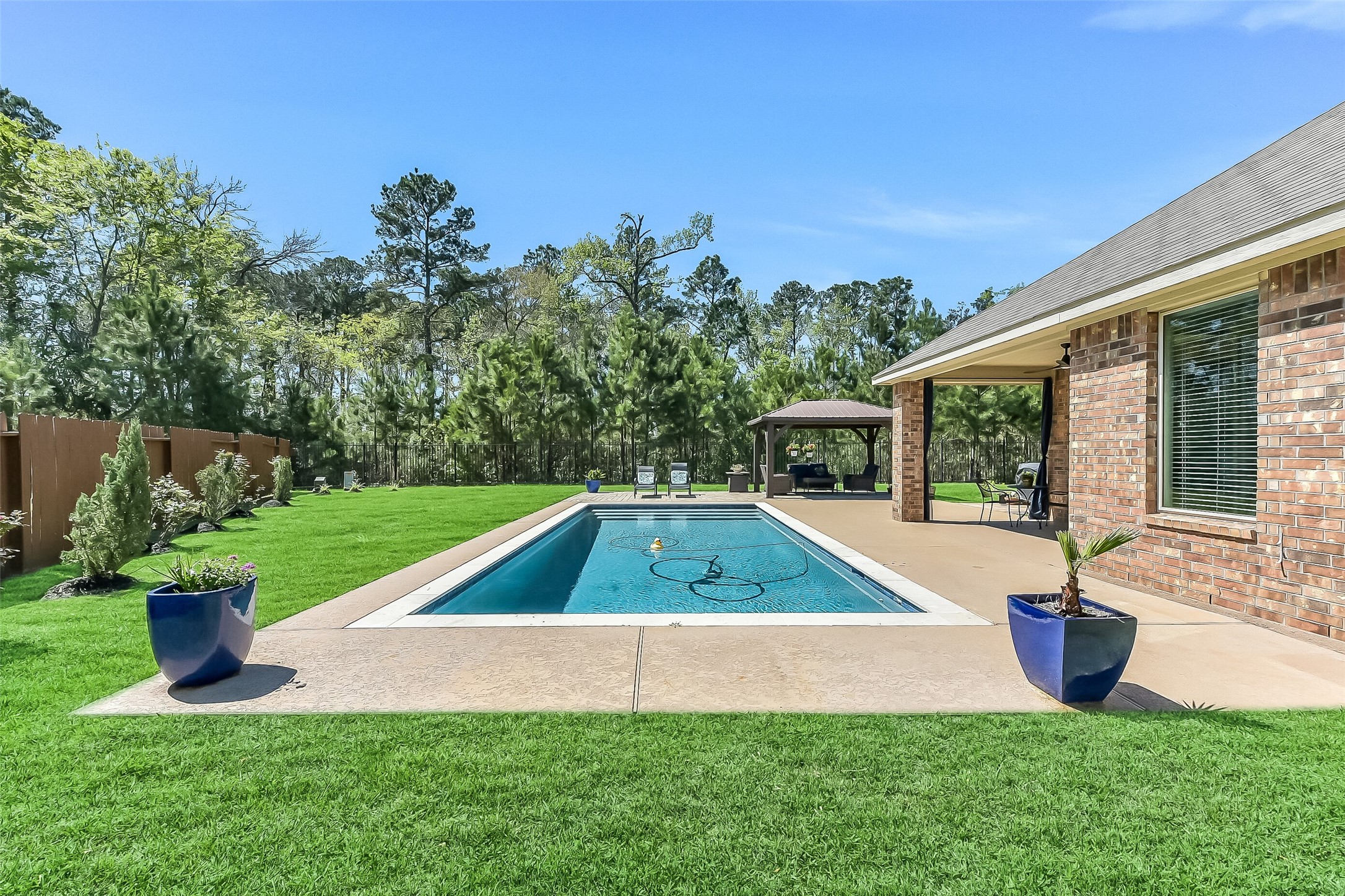 24407 Hollow Gate Meadow Court Spring, TX 77389 - Photo 2 of 39 a view of a house with a yard and a patio