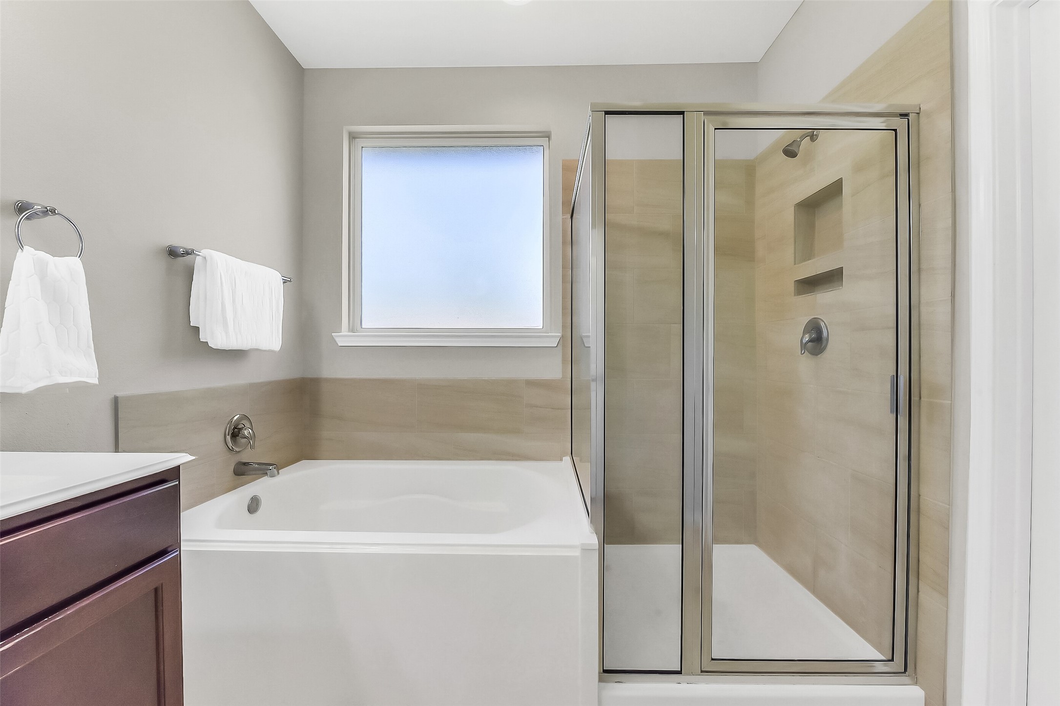 24407 Hollow Gate Meadow Court Spring, TX 77389 - Photo 21 of 39 a bathroom with a bathtub and a shower