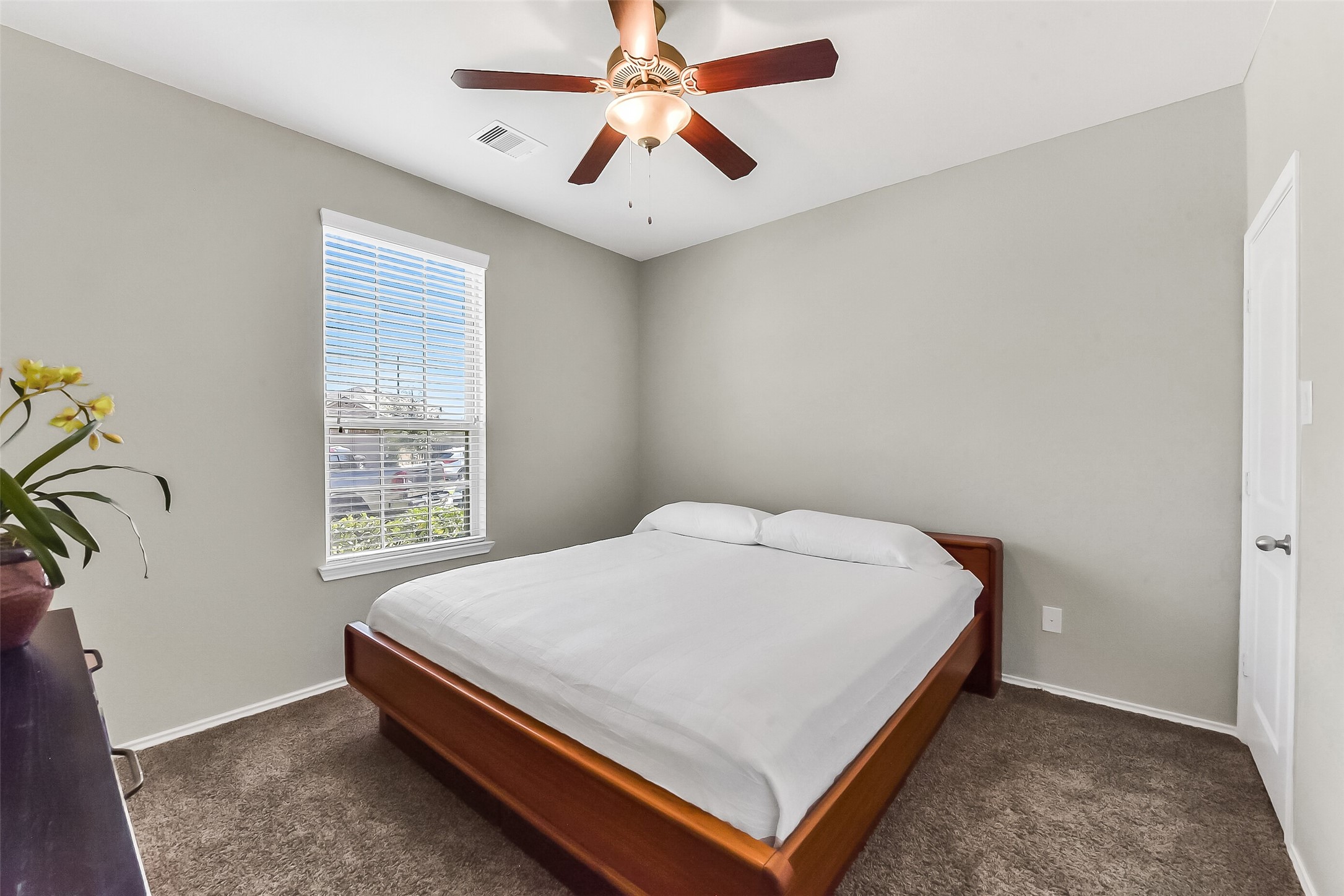 24407 Hollow Gate Meadow Court Spring, TX 77389 - Photo 23 of 39 a bed sitting in a bedroom next to a window
