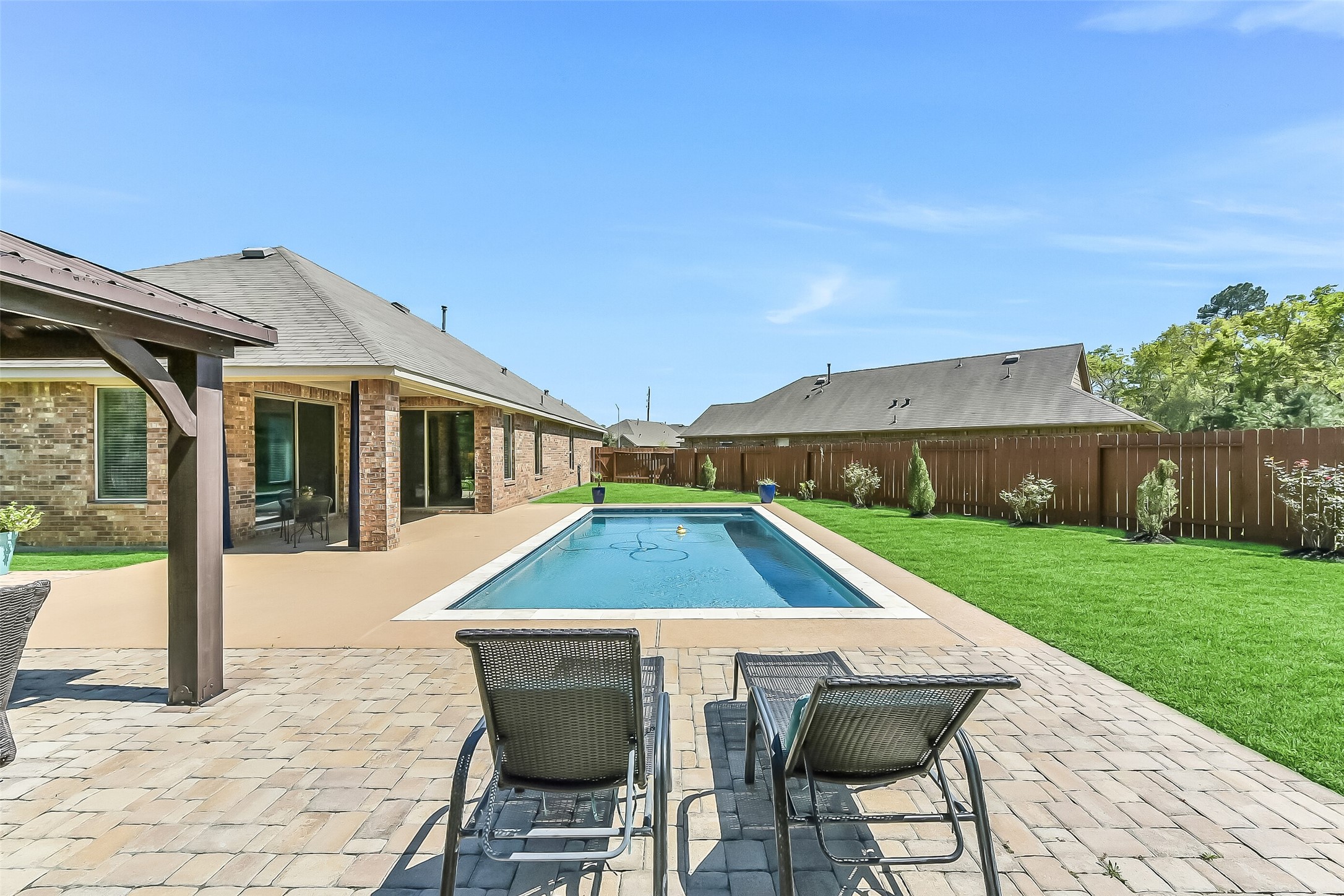 24407 Hollow Gate Meadow Court Spring, TX 77389 - Photo 27 of 39 a front view of house with yard and patio