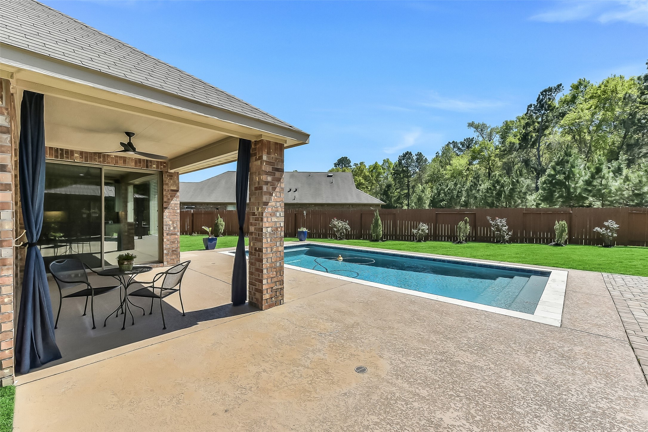 24407 Hollow Gate Meadow Court Spring, TX 77389 - Photo 28 of 39 a view of outdoor space yard deck patio and swimming pool