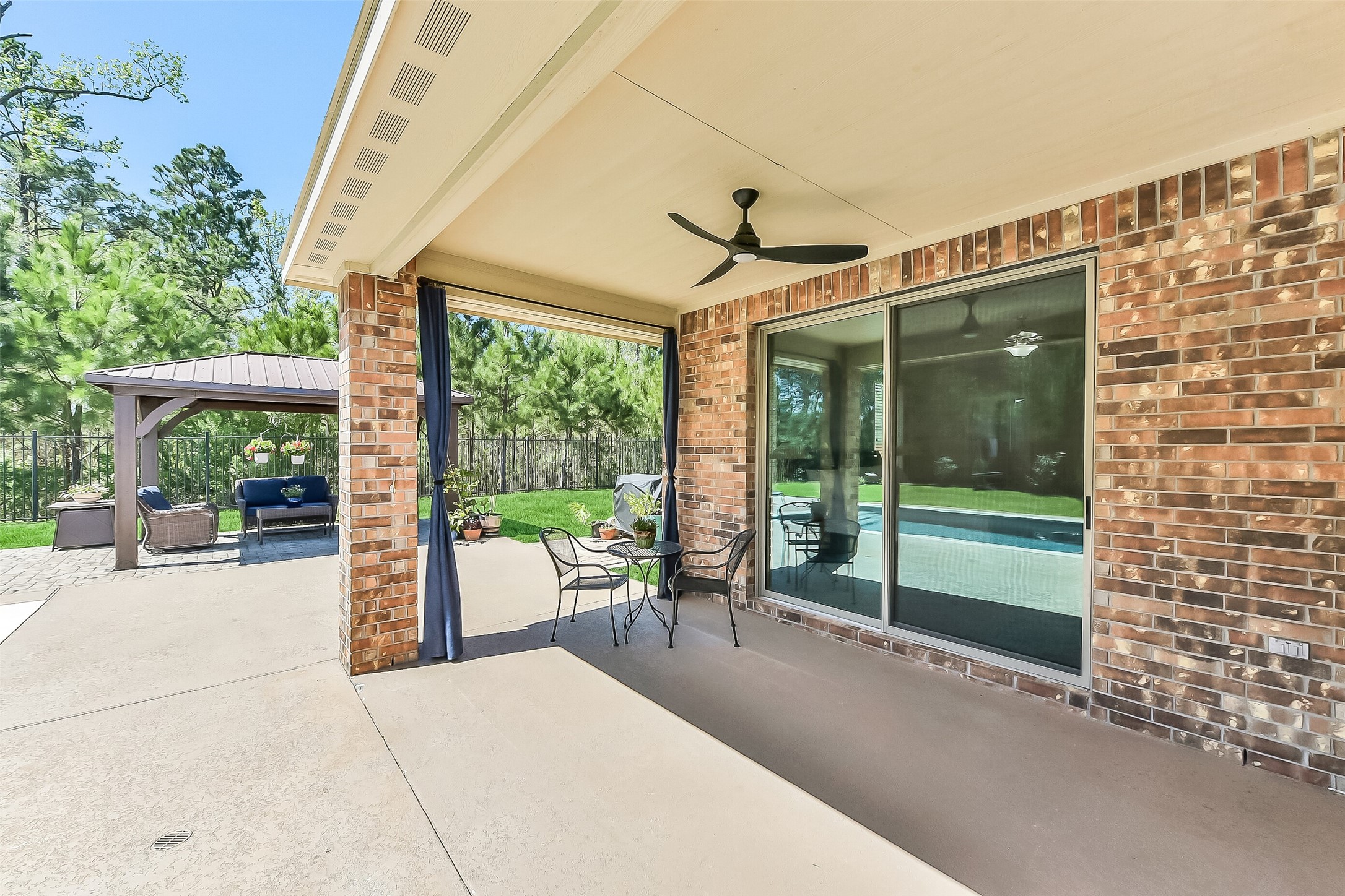 24407 Hollow Gate Meadow Court Spring, TX 77389 - Photo 30 of 39 a porch with a table and chairs