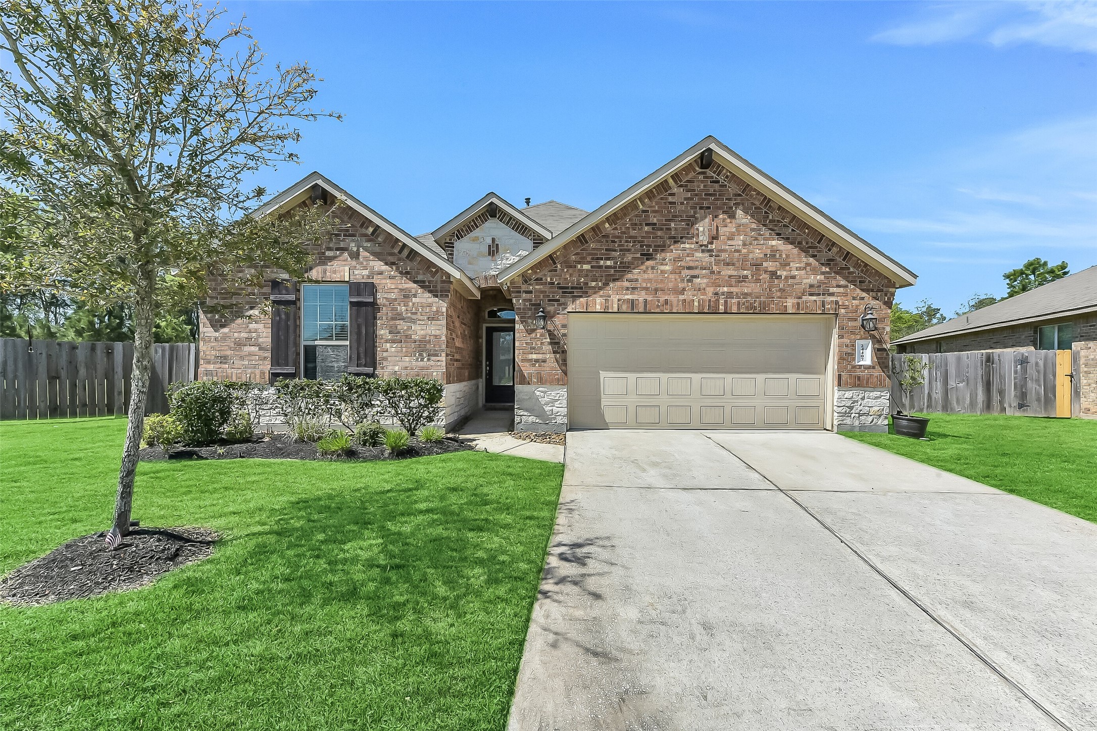 24407 Hollow Gate Meadow Court Spring, TX 77389 - Photo 3 of 39 a view of a house with yard and tree s