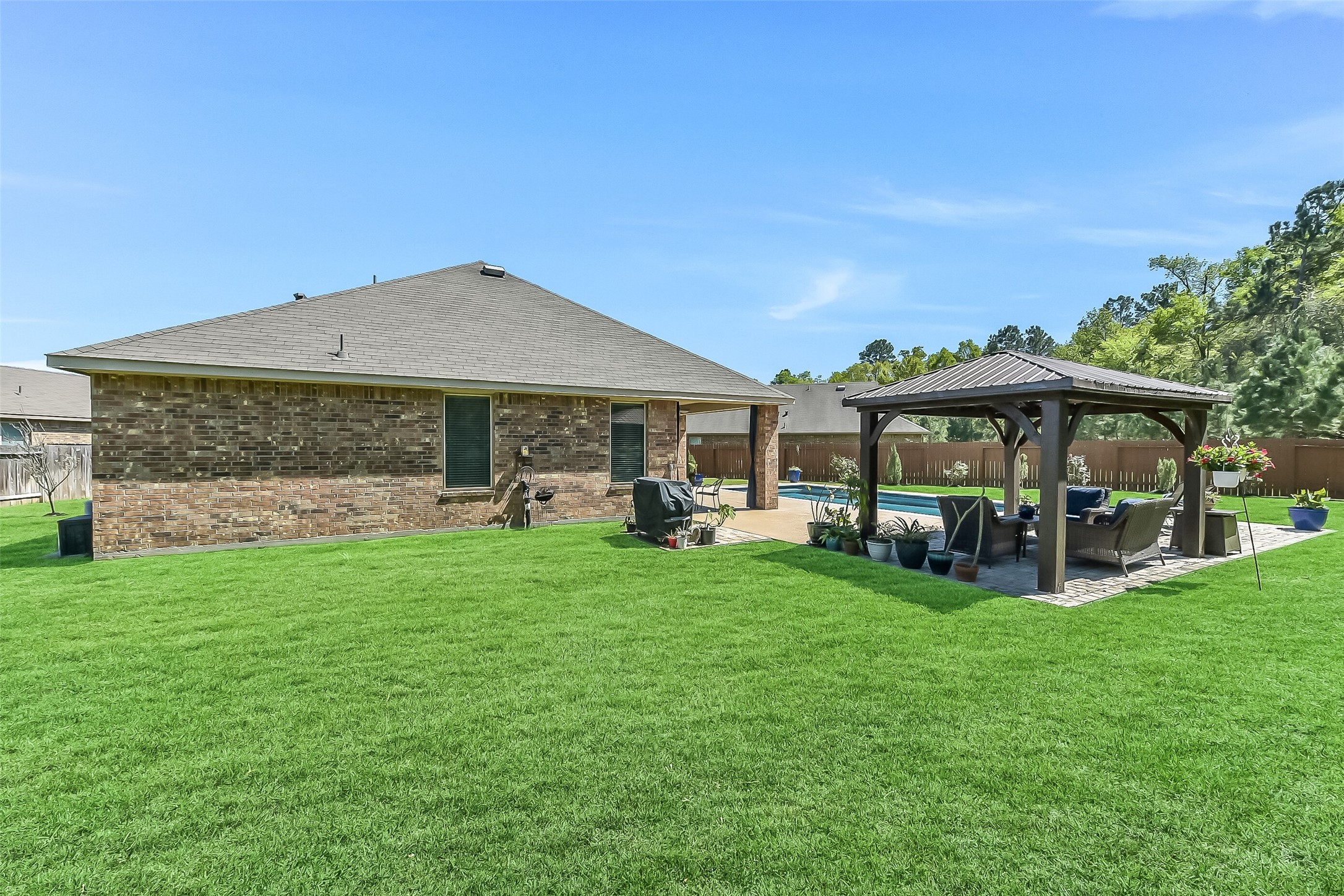 24407 Hollow Gate Meadow Court Spring, TX 77389 - Photo 33 of 39 a view of a house with garden and sitting area