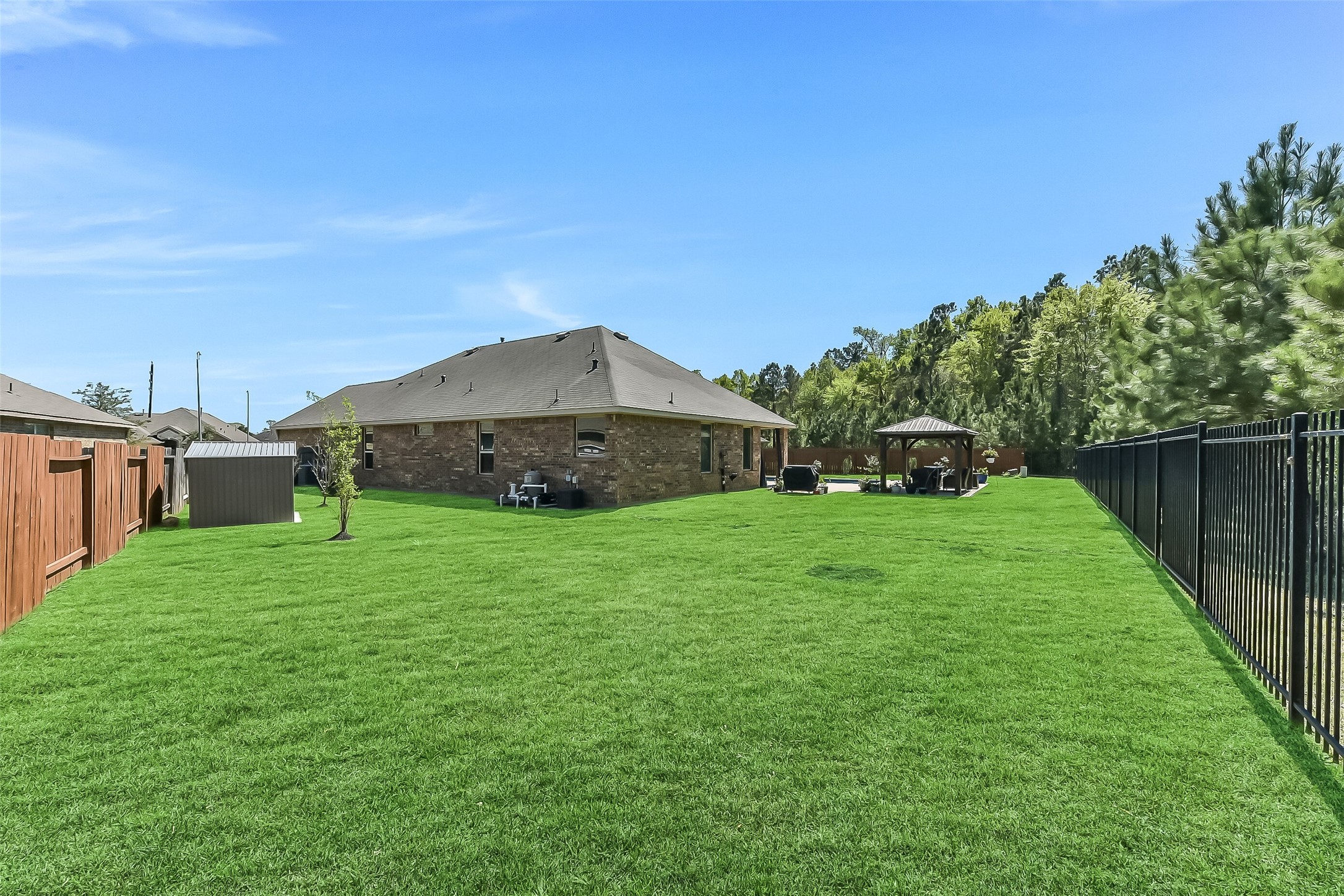 24407 Hollow Gate Meadow Court Spring, TX 77389 - Photo 35 of 39 a view of a house with backyard and garden