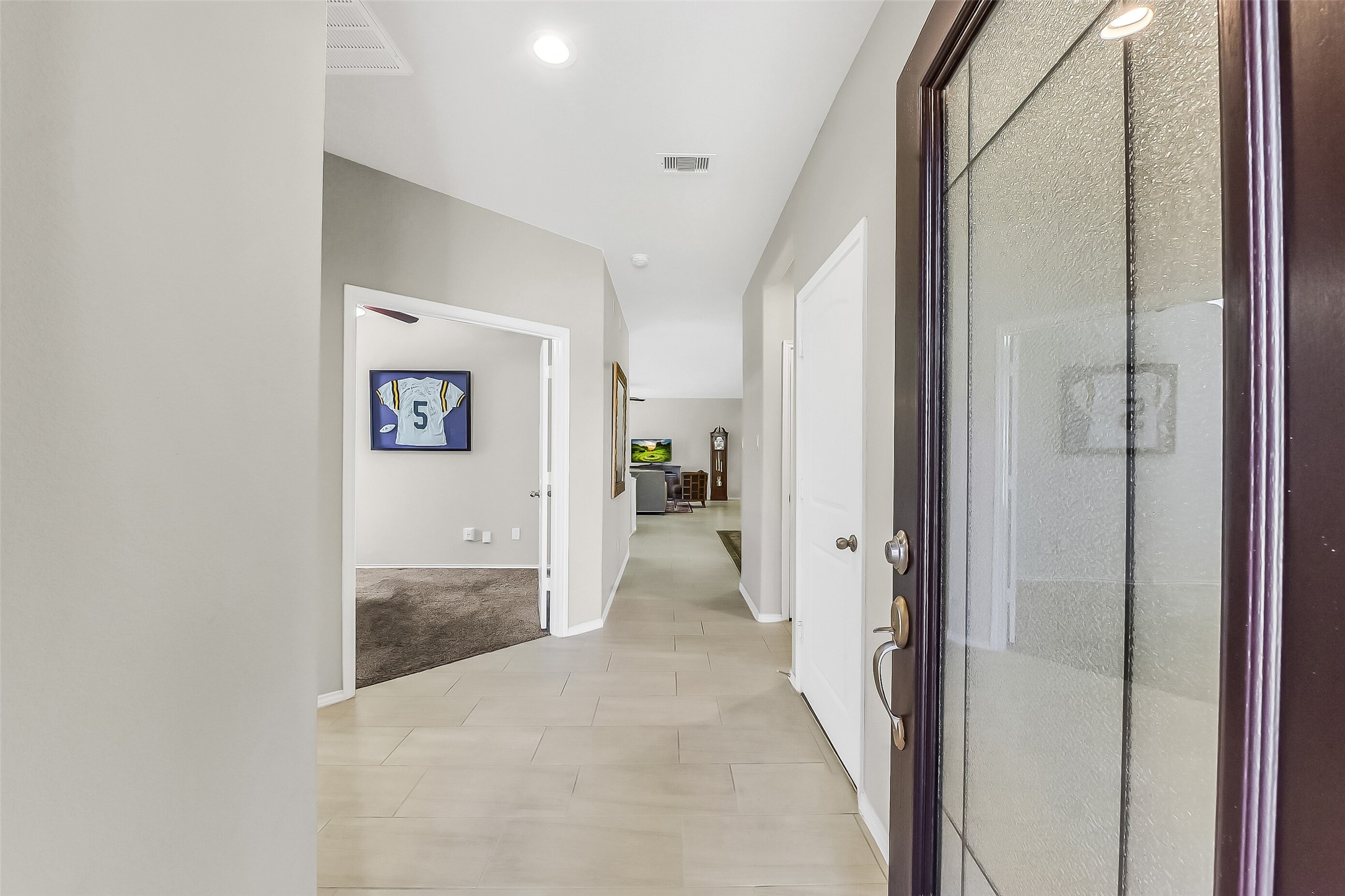 24407 Hollow Gate Meadow Court Spring, TX 77389 - Photo 4 of 39 a view of a hallway with wooden shelves