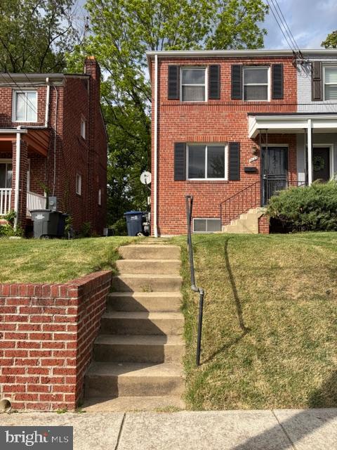 3024 M Street Southeast Washington, DC 20019 - Photo 1 of 8 a front view of a house with a yard