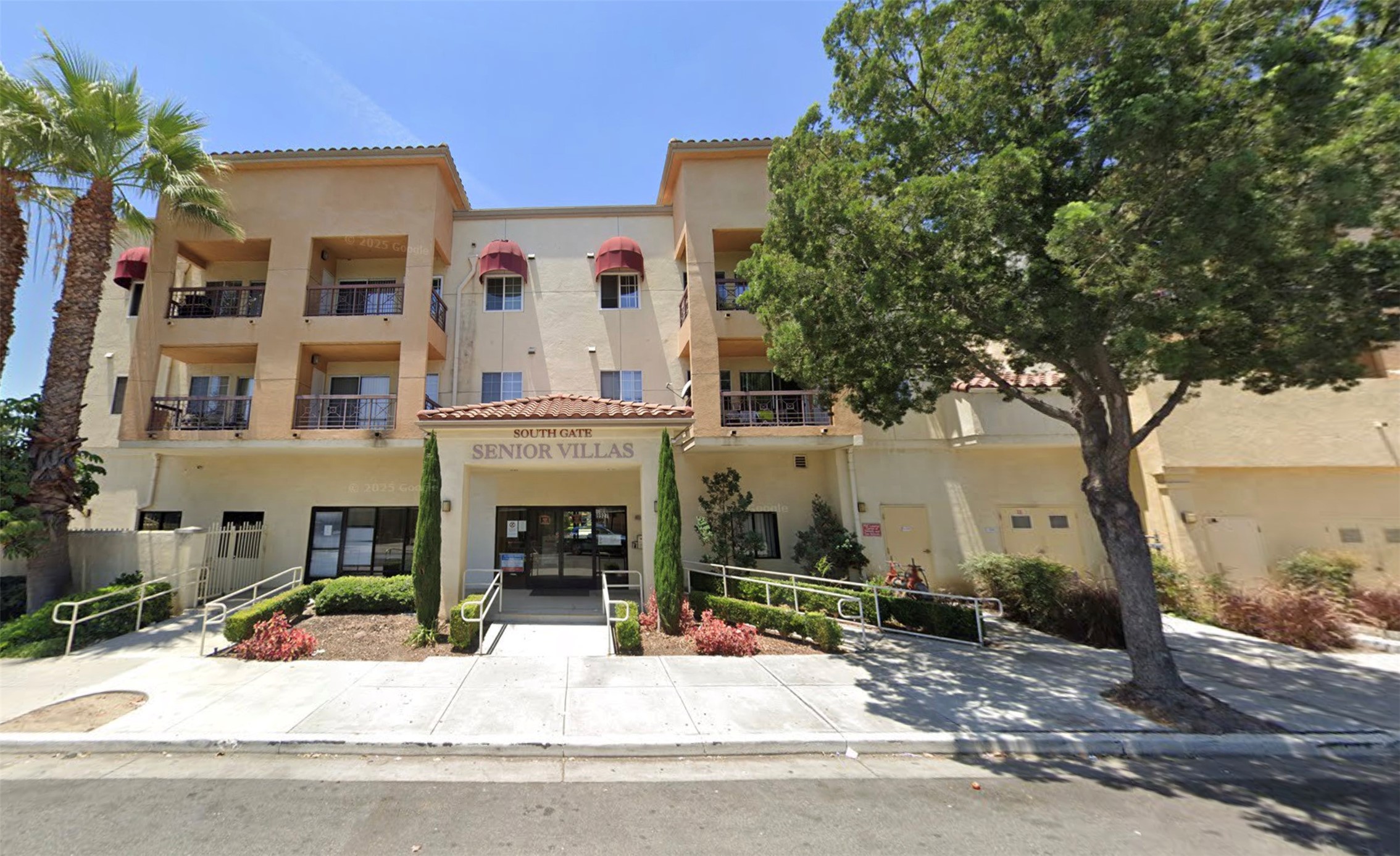 9927 San Antonio Avenue South Gate, CA 90280 - Photo 1 of 8 a view of a building with a tree in front of it