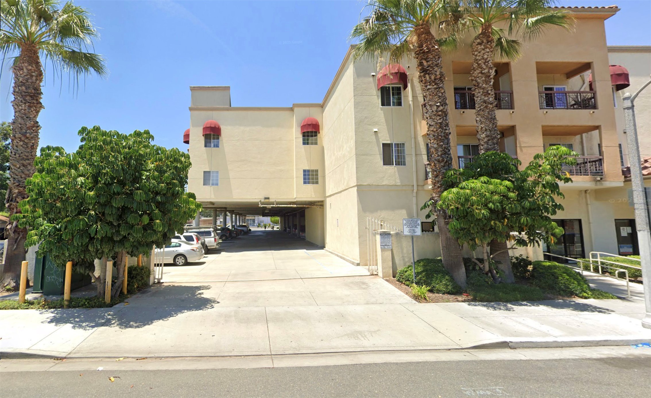 9927 San Antonio Avenue South Gate, CA 90280 - Photo 3 of 8 a building with trees in front of it