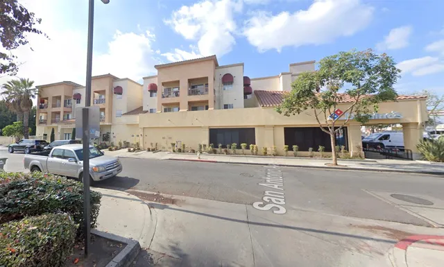 a front view of a building with outdoor space