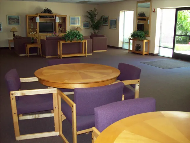 a view of a livingroom with furniture window and wooden floor