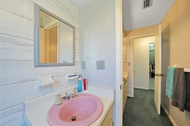 a view of a livingroom with furniture and staircase
