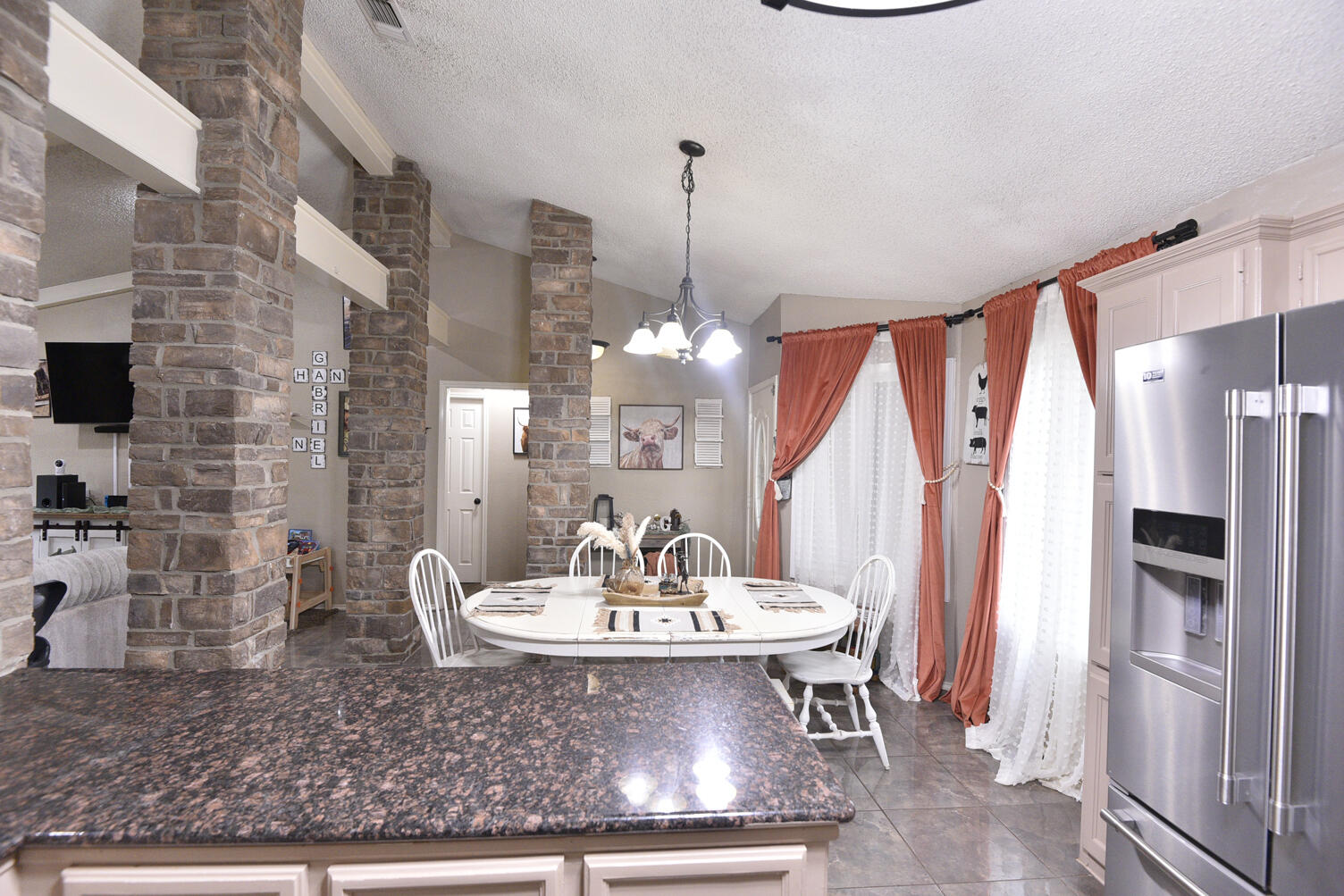5202 93rd Street Lubbock, TX 79424 - Photo 12 of 28 a view of a dining room with furniture