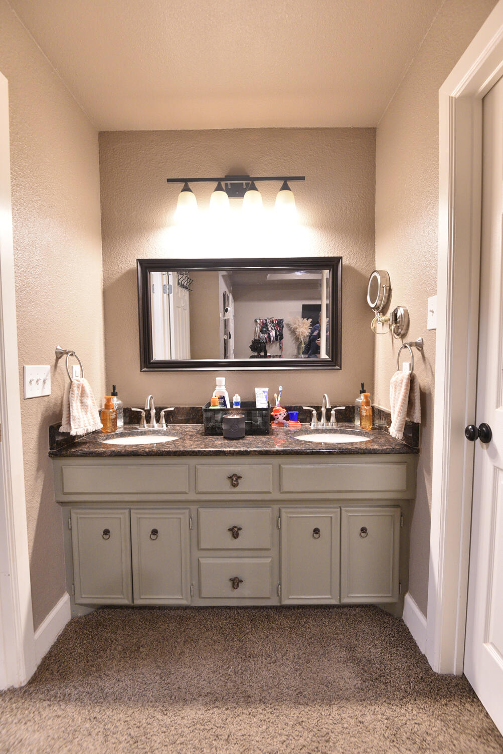 5202 93rd Street Lubbock, TX 79424 - Photo 17 of 28 a bathroom with a sink vanity and mirror