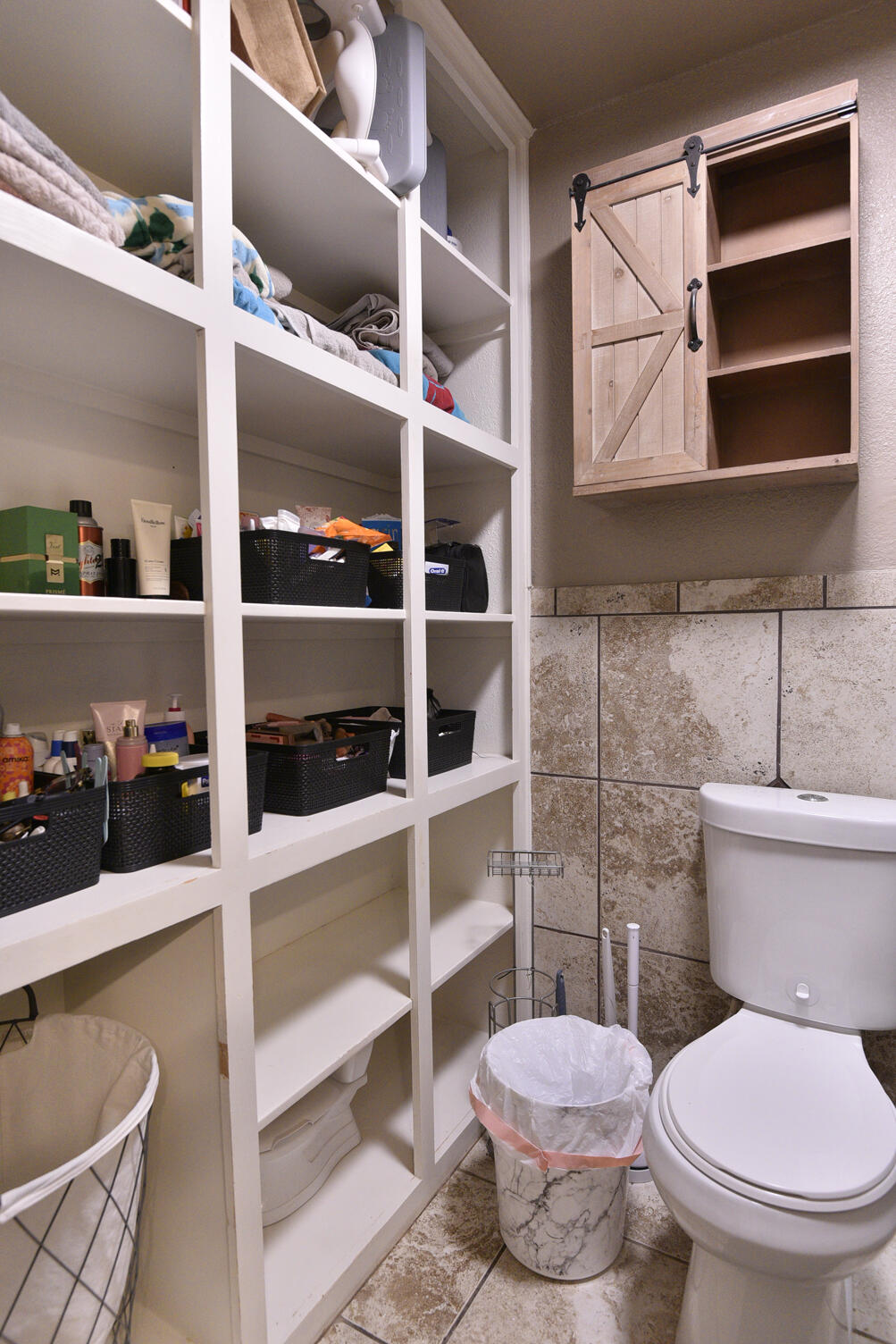 5202 93rd Street Lubbock, TX 79424 - Photo 19 of 28 a bathroom with a toilet and a shower