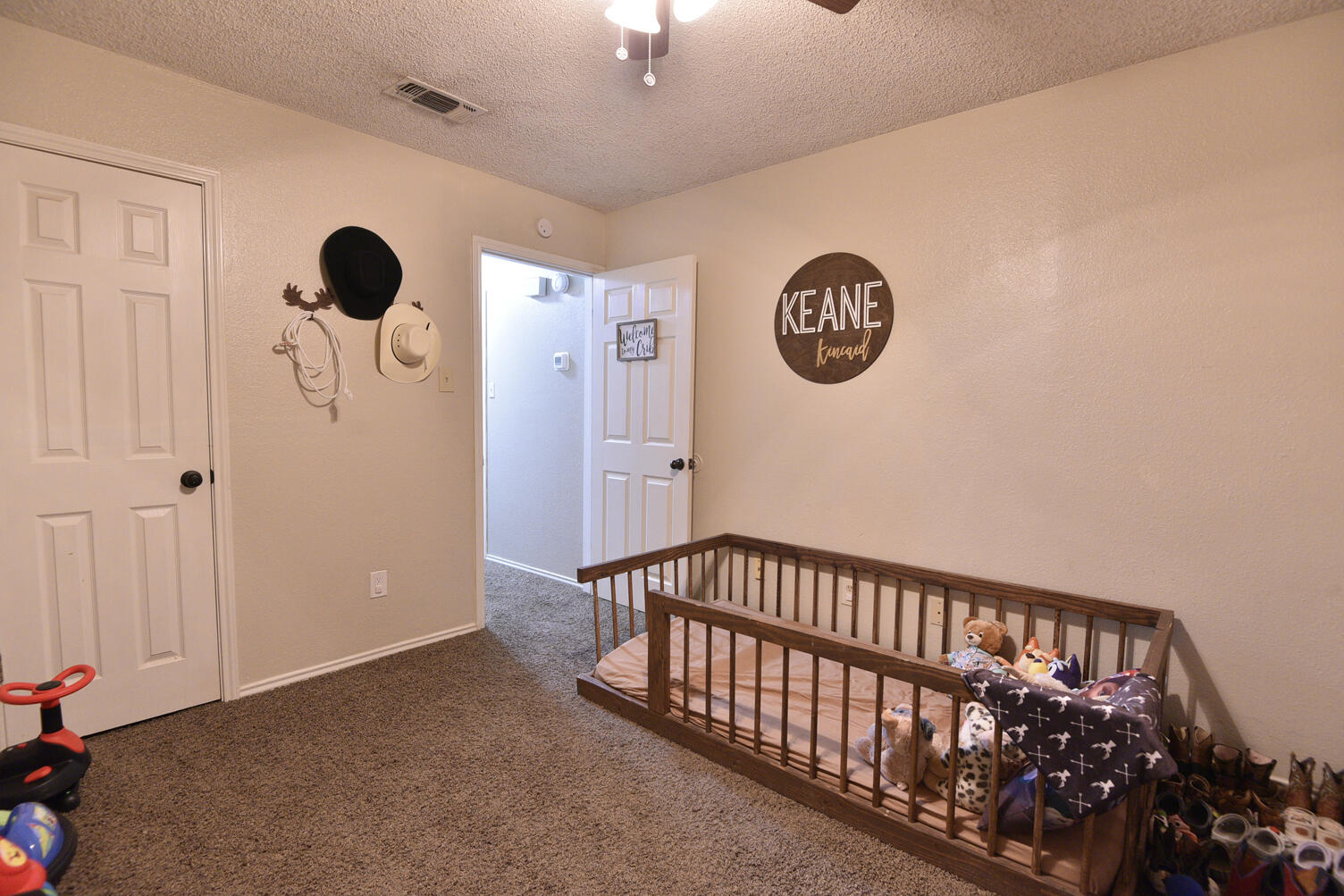 5202 93rd Street Lubbock, TX 79424 - Photo 21 of 28 a view of entryway with a window and wooden floor