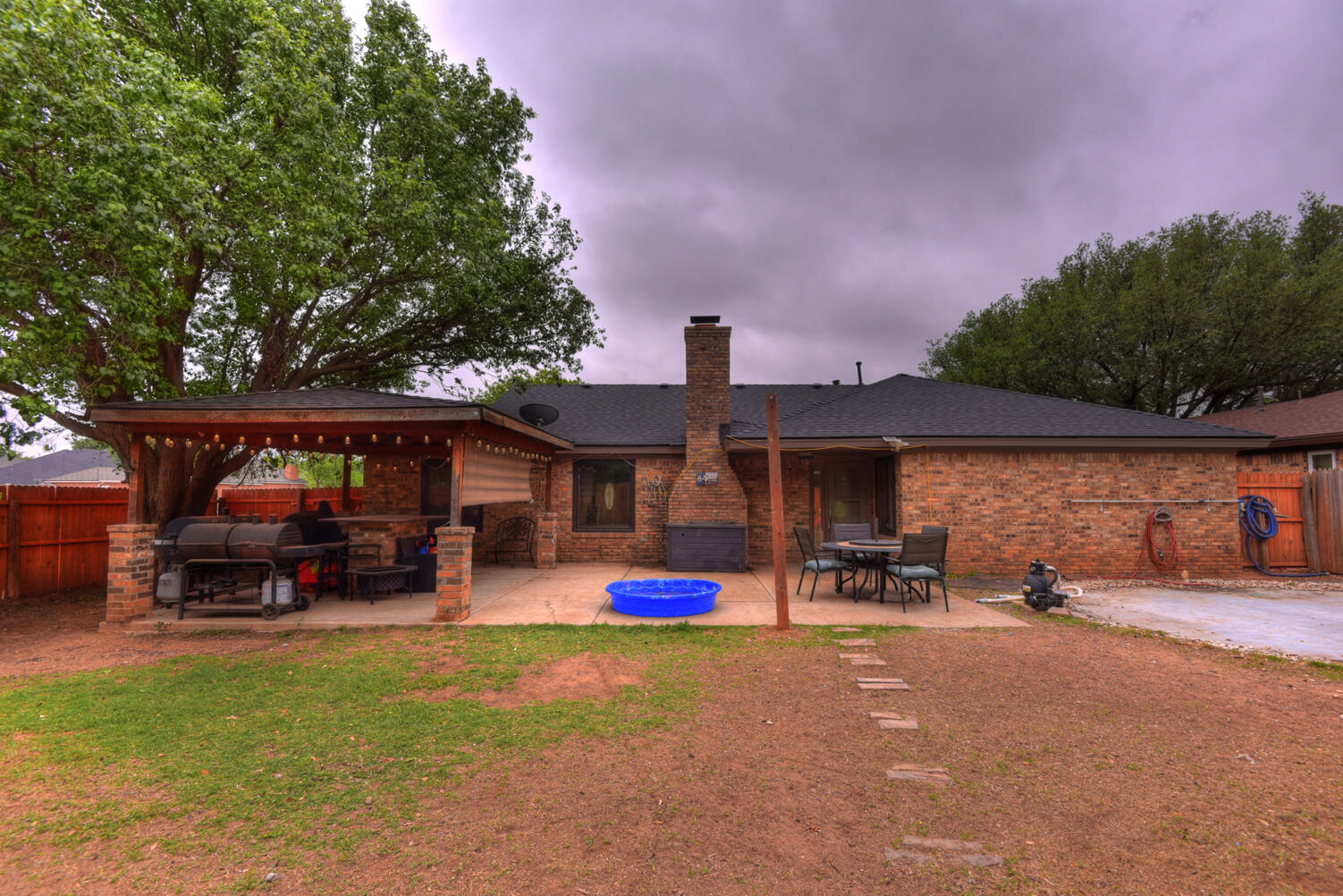 5202 93rd Street Lubbock, TX 79424 - Photo 25 of 28 a front view of a house with cars parked