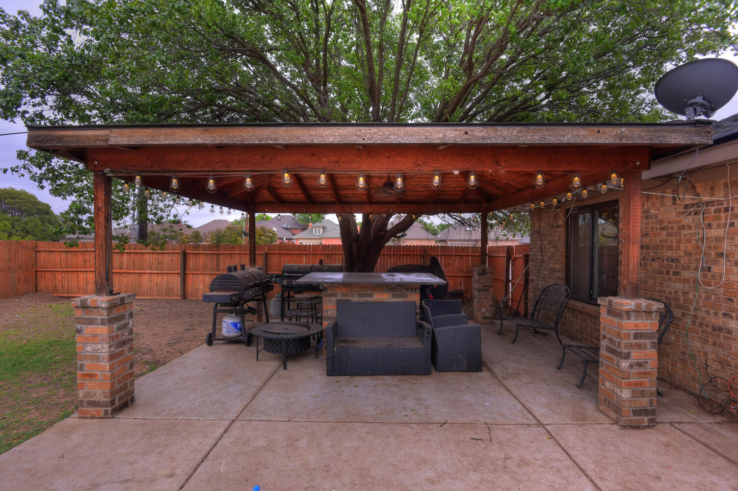 5202 93rd Street Lubbock, TX 79424 - Photo 26 of 28 a view of a patio with table and chairs