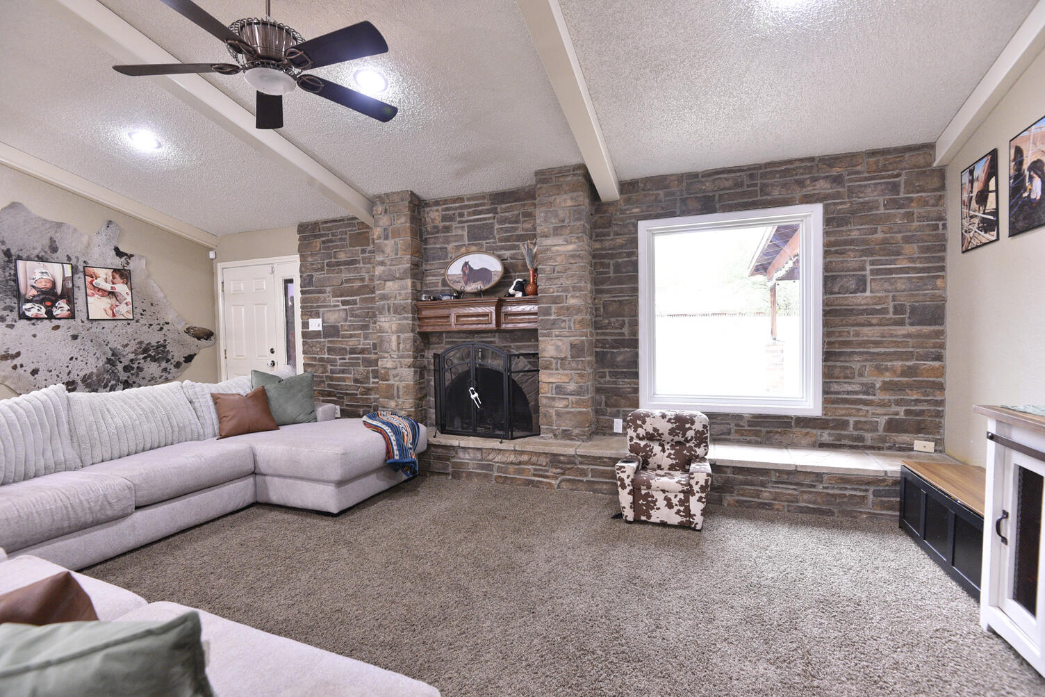 5202 93rd Street Lubbock, TX 79424 - Photo 5 of 28 a living room with furniture and a fireplace
