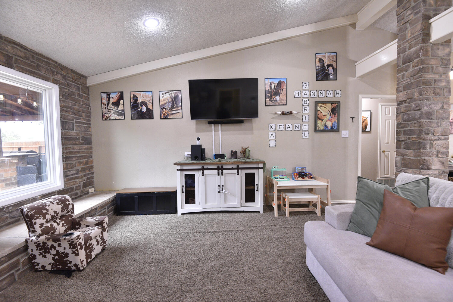 5202 93rd Street Lubbock, TX 79424 - Photo 6 of 28 a living room with furniture and a flat screen tv
