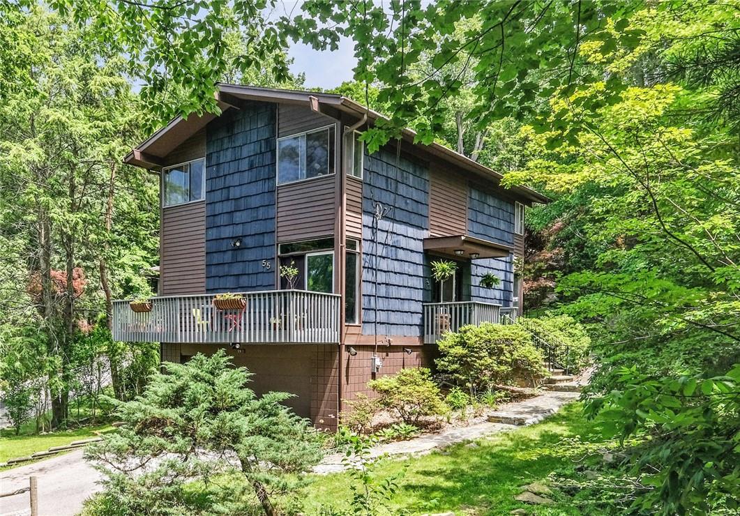 55 Bramblebrook Road Ardsley, NY 10502 - Photo 1 of 1 front view of a house with a small yard