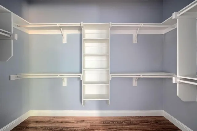 a view of an empty walk in closet