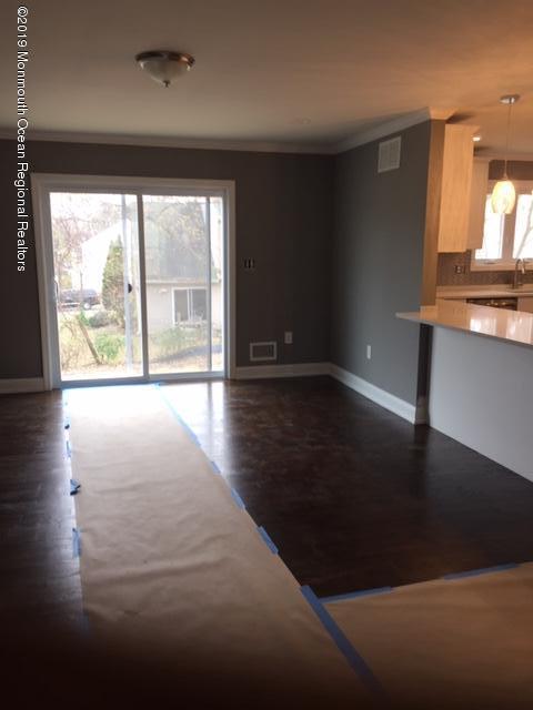 135 County Road Cliffwood, NJ 07721 - Photo 8 of 18 135 Family room with wood flooring