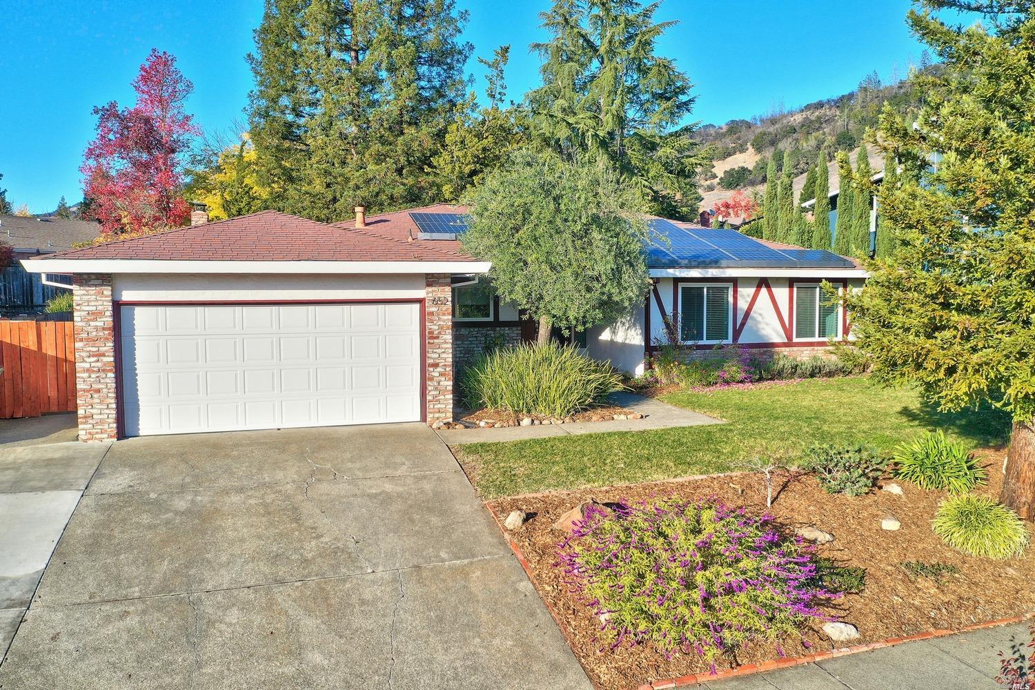 a front view of a house with garden