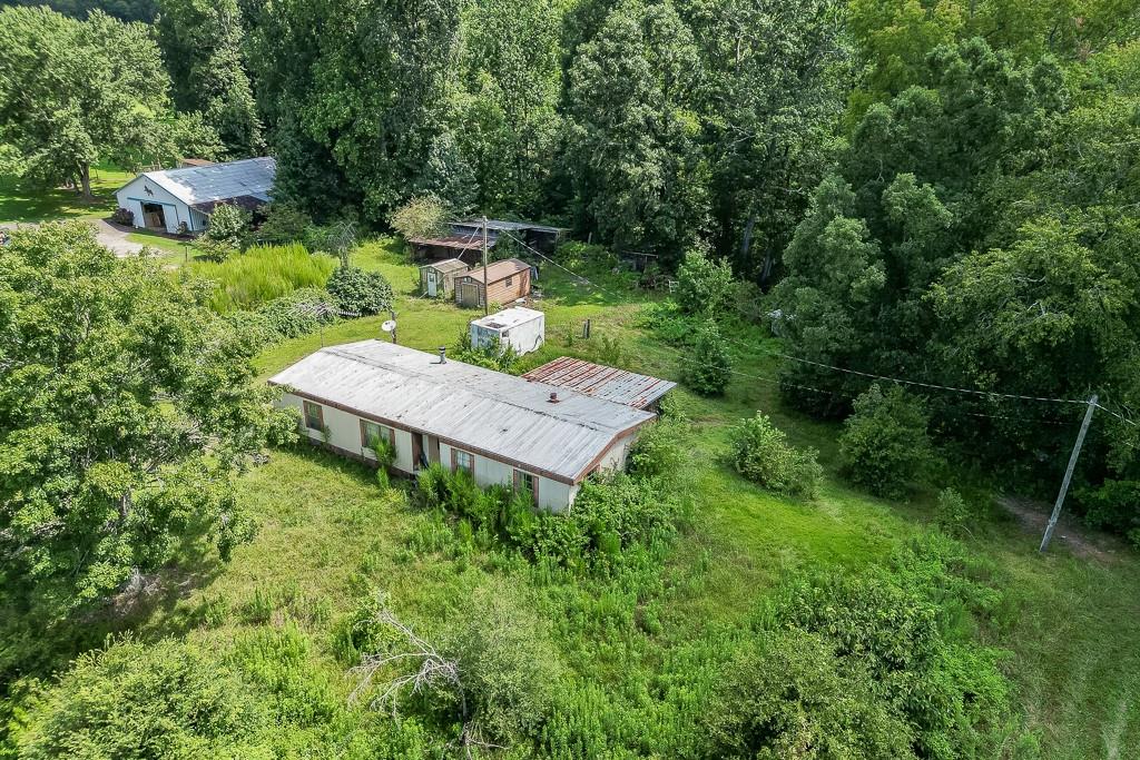 3340 Chamblee Gap Road Cumming, GA 30040 - Photo 6 of 15 a view of a backyard with table and chairs plants and large trees