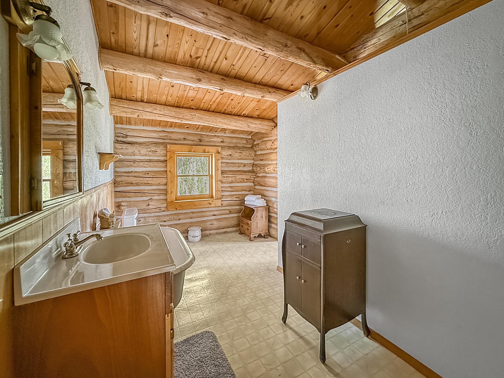 9709 3605 Road Hotchkiss, CO 81419 - Photo 20 of 42 a bathroom with a sink and a mirror