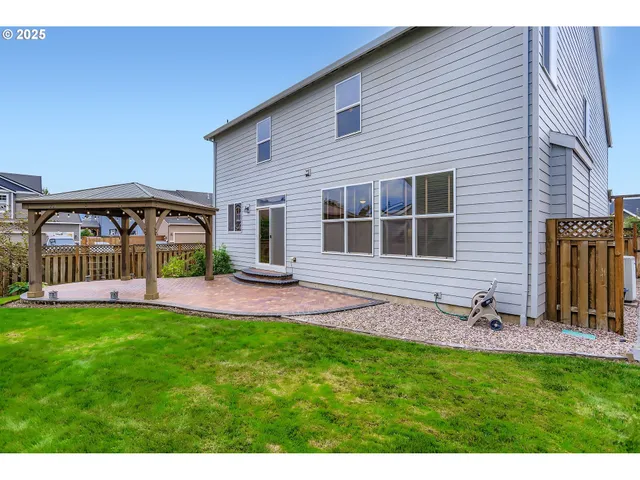 a view of a backyard with a patio
