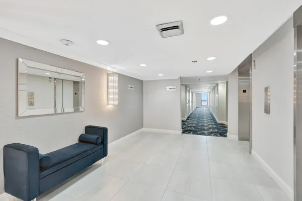 a view of a hallway with a chandelier