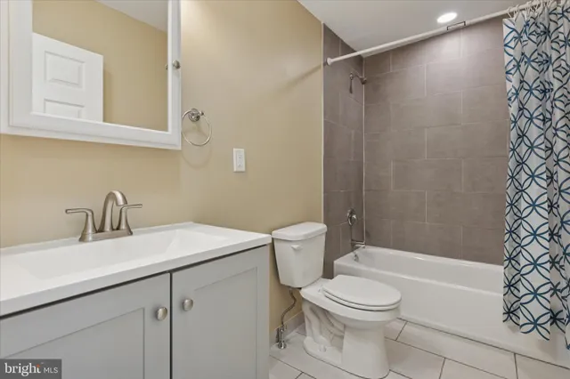 a view of a room with wooden floor and windows