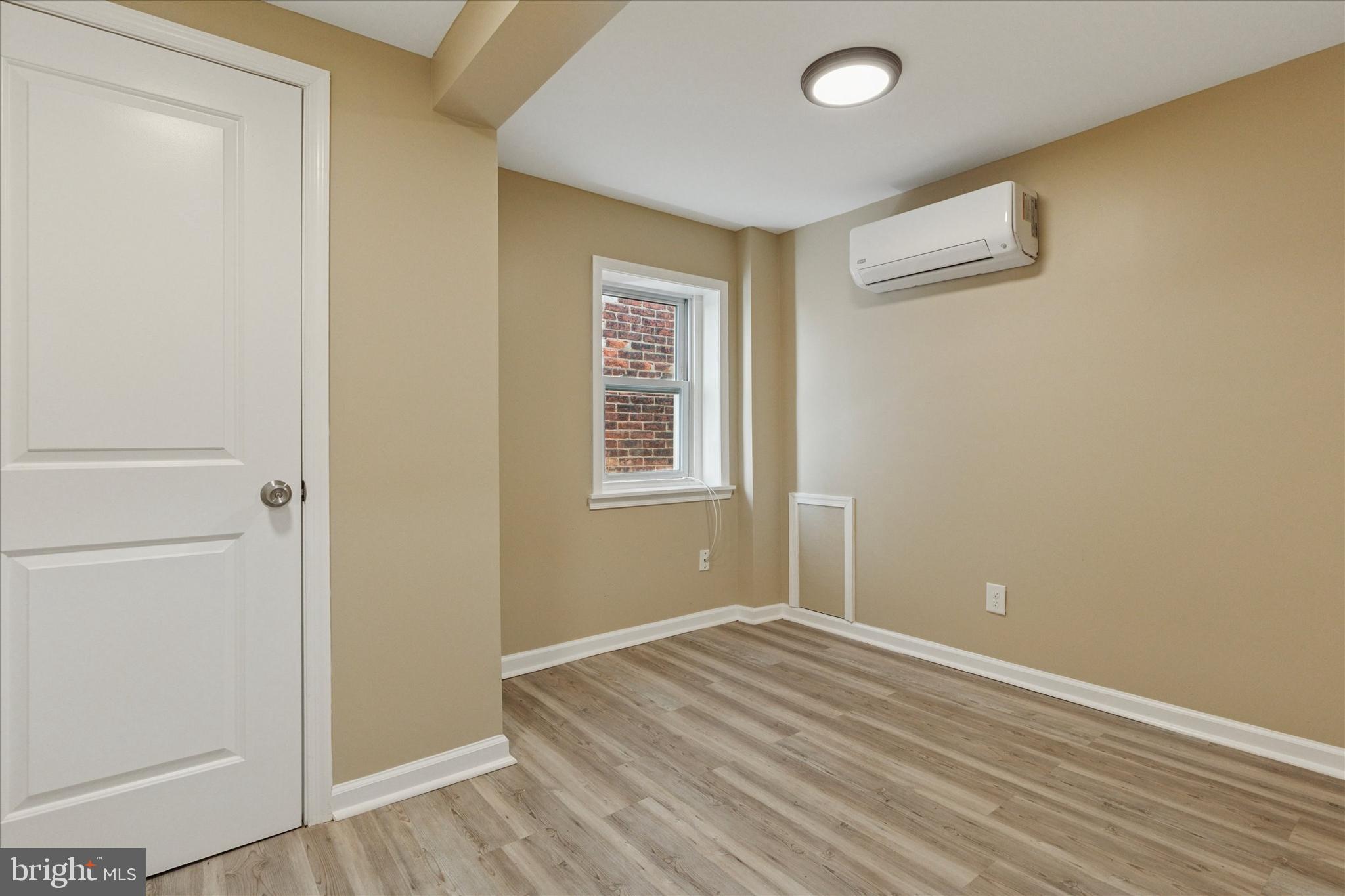 39 West Front Street Bridgeport, PA 19405 - Photo 17 of 23 a view of a room with wooden floor and windows