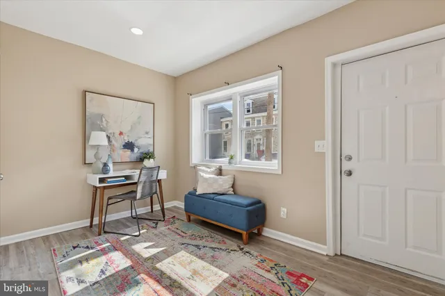 a living room with a couch and a window