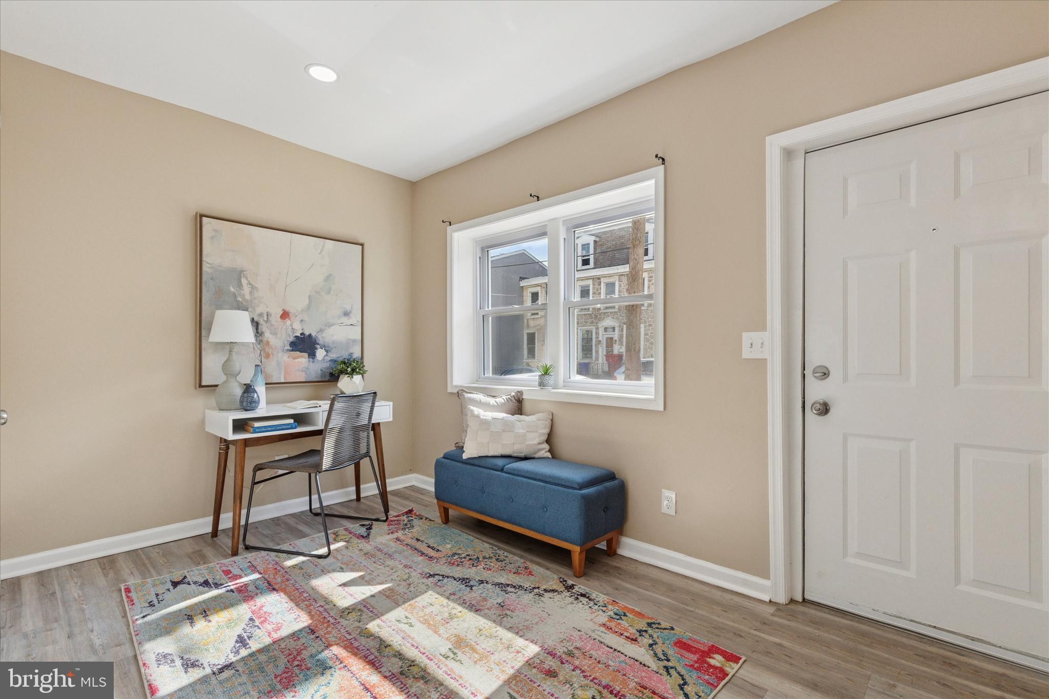 39 West Front Street Bridgeport, PA 19405 - Photo 2 of 23 a living room with a couch and a window