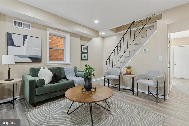 a living room with furniture and a table
