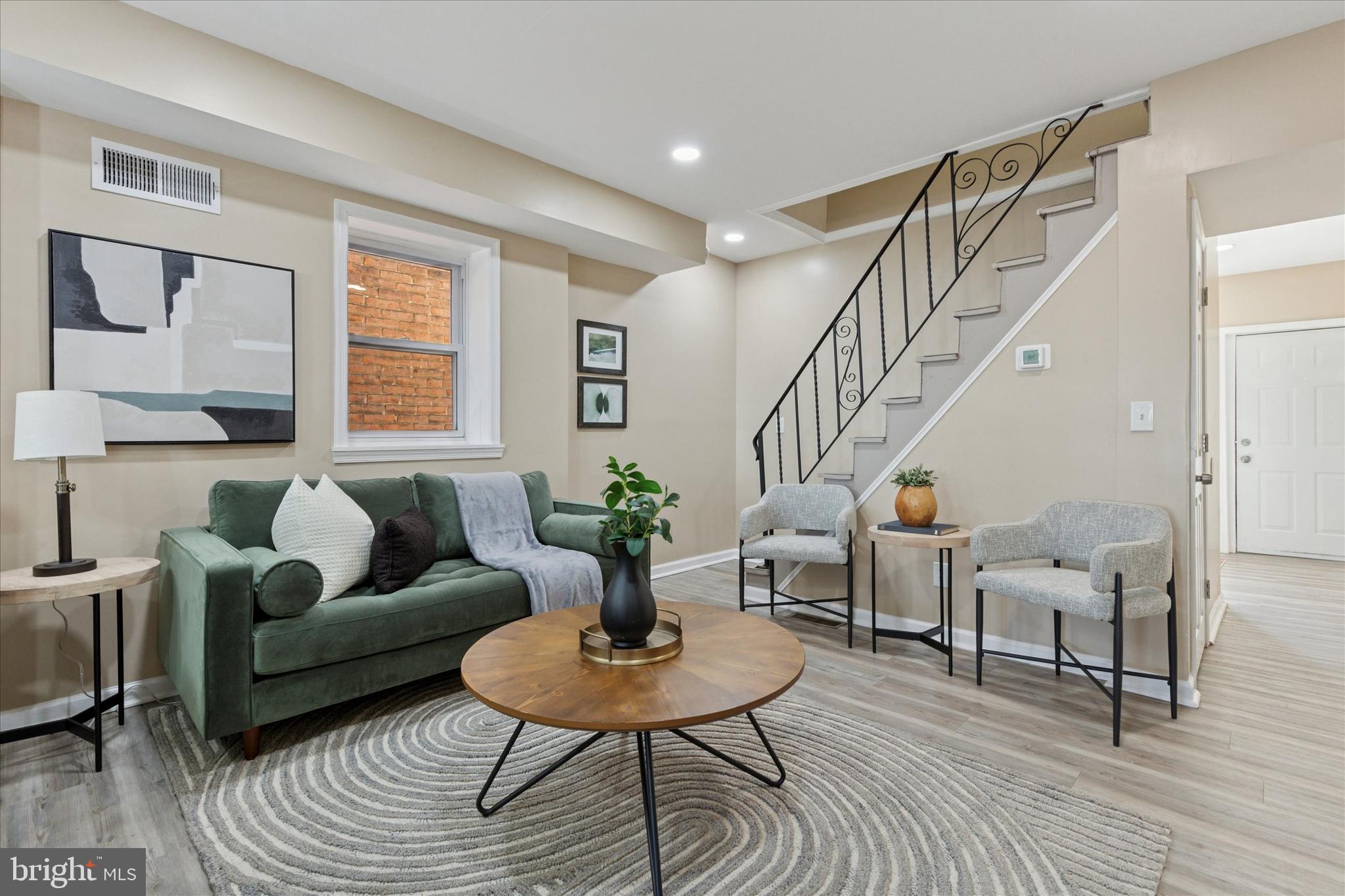 39 West Front Street Bridgeport, PA 19405 - Photo 7 of 23 a living room with furniture and a table