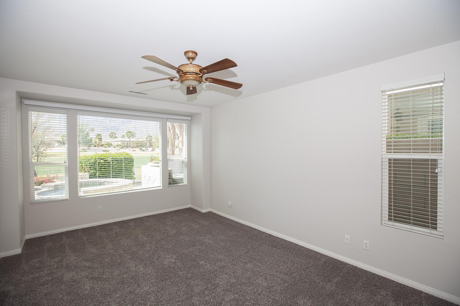81237 Red Rock Road La Quinta, CA 92253 - Photo 12 of 21 a view of a livingroom with a ceiling fan and window