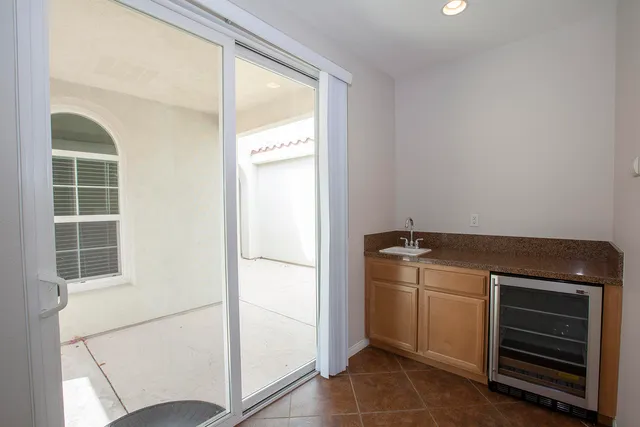 a kitchen with a stove and a refrigerator