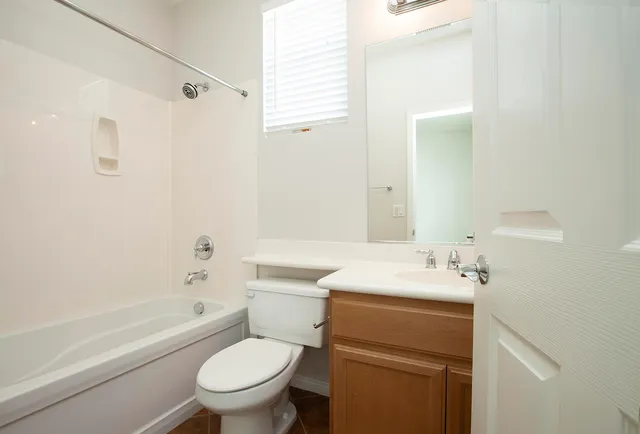 a bathroom with a sink a toilet and a bathtub