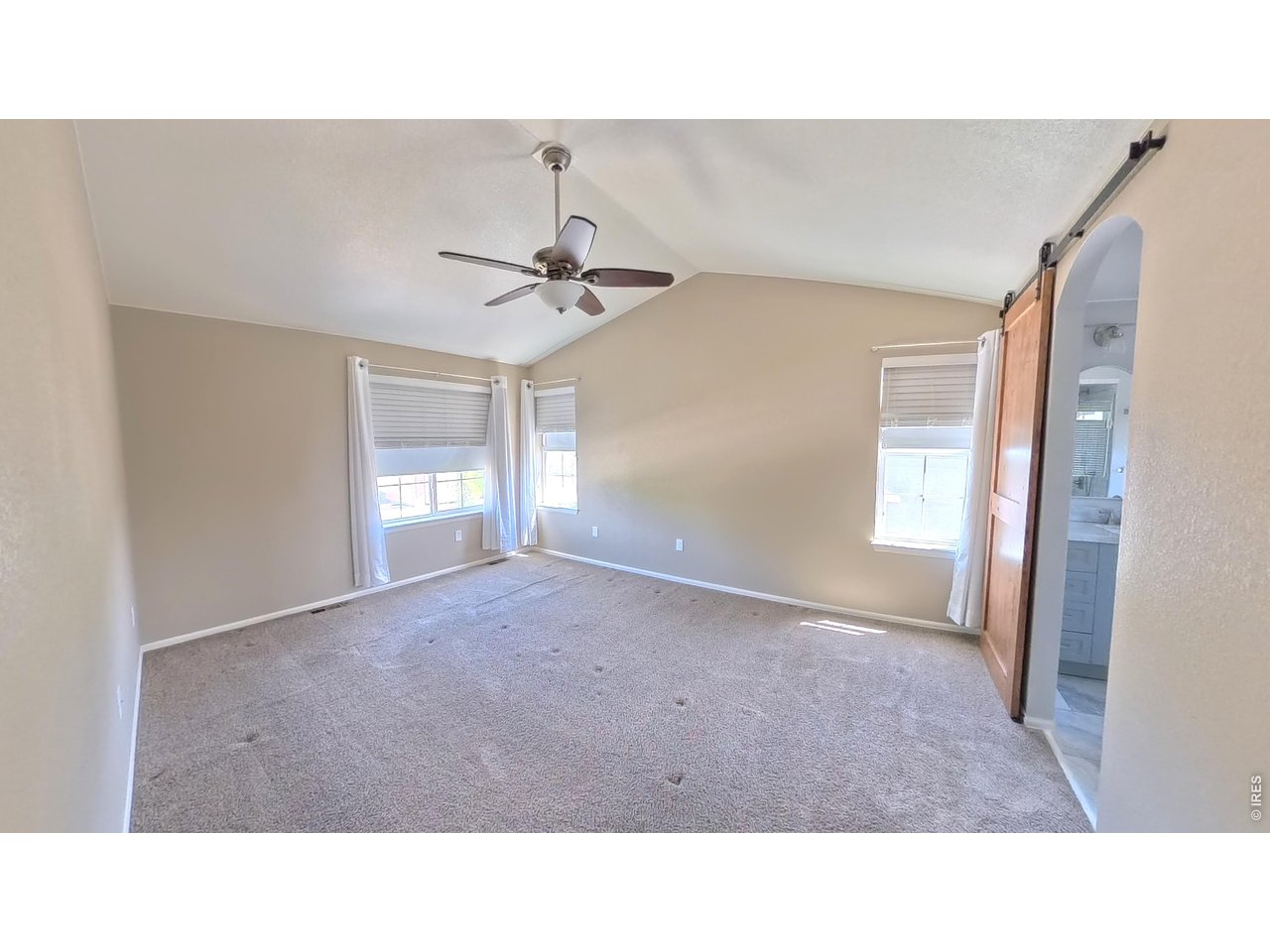 10434 Bluegrass Street Firestone, CO 80504 - Photo 15 of 26 Primary bedroom offers plenty of space and light
