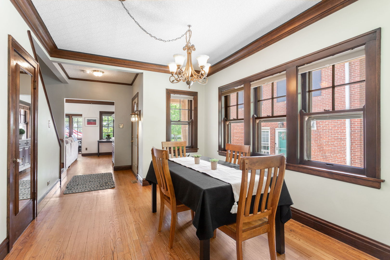342 Lawton Road Riverside, IL 60546 - Photo 6 of 33 a view of a dining room with furniture window and wooden floor
